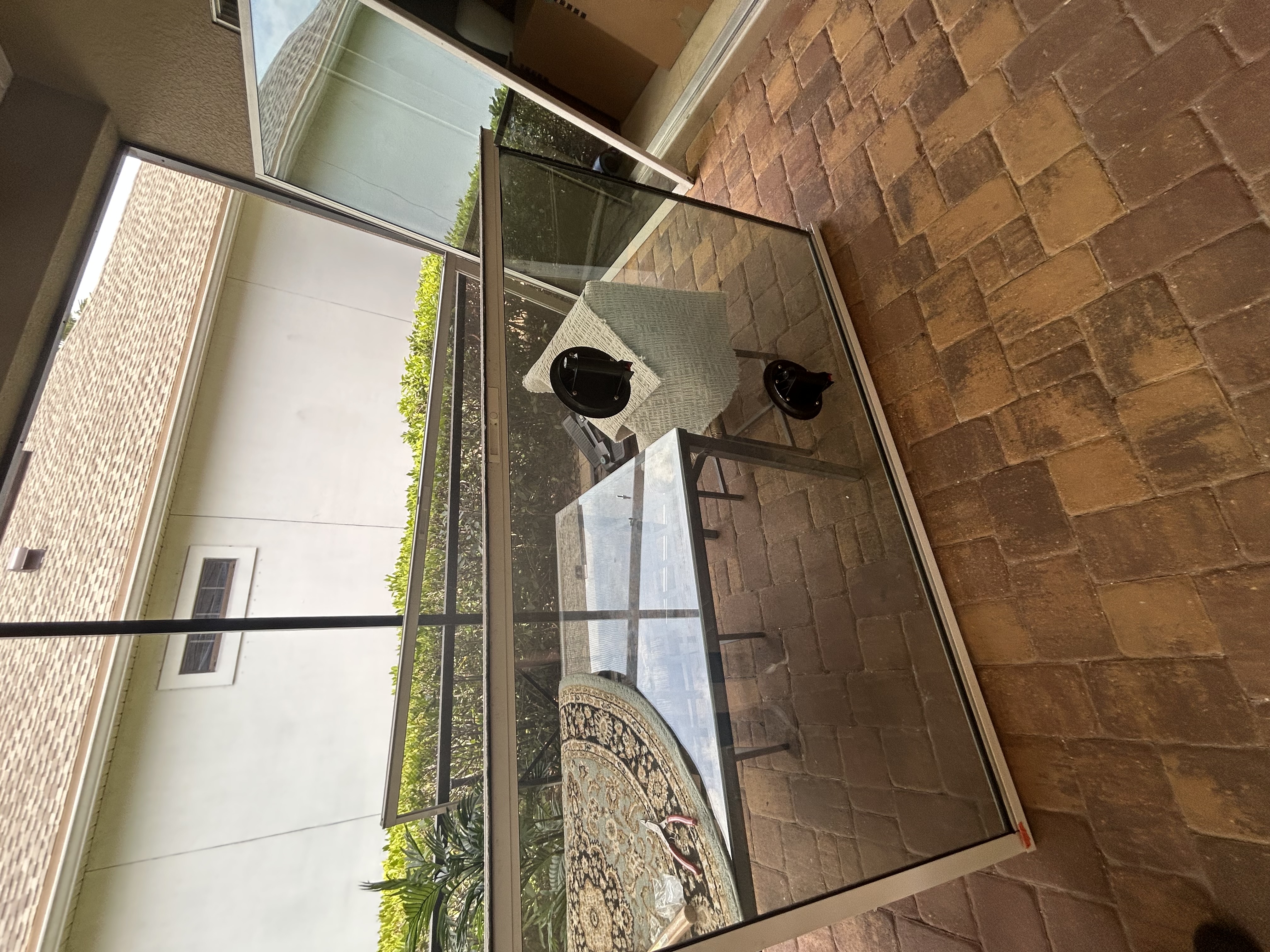 Sliding glass door panel pulled out of its frame during repair